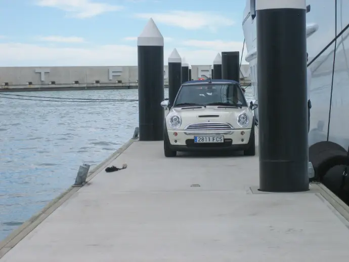 Vehicle access along a marina dock supporting modern utility infrastructure